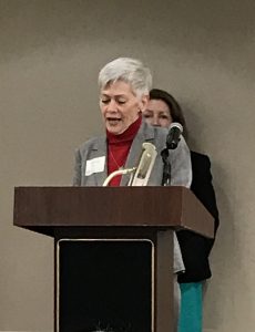 Debbie Lane at a podium