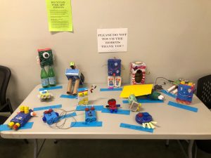 Children's art projects displayed on a table