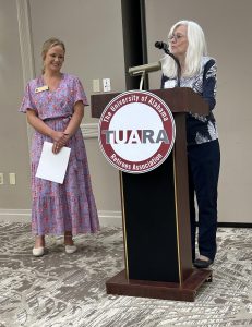 Debbie Lane presents the Partnership Award at the 2024 TUARA Luncheon.