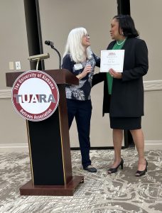 Debbie Lane presents the Bonner Award to Pamela Pruitt at the 2024 TUARA Luncheon.